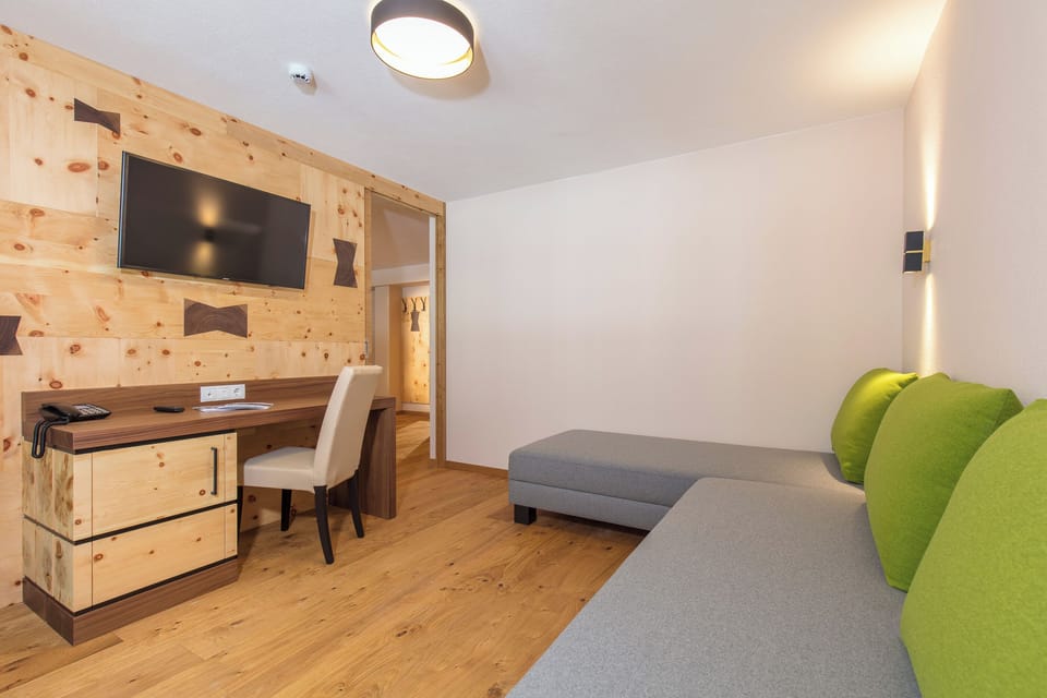 Deluxe Room, Balcony | Living area | TV
