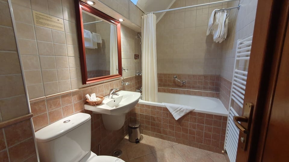 Comfort Double or Twin Room | Bathroom | Combined shower/tub, hair dryer, towels, soap
