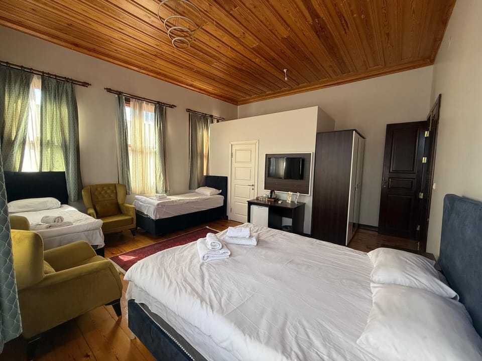 Classic Quadruple Room, Multiple Beds | Premium bedding, minibar, desk, laptop workspace