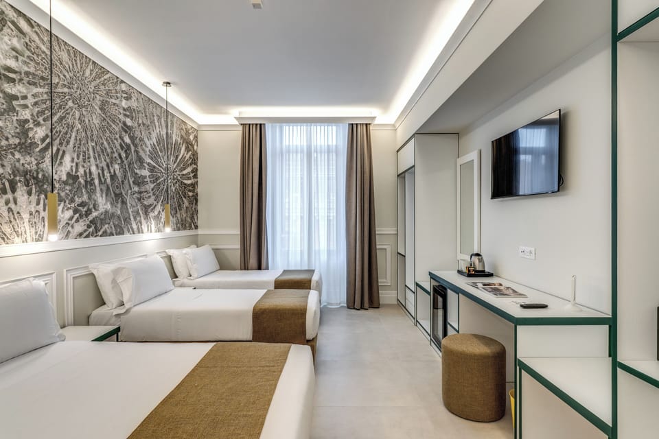 Deluxe Quadruple Room | Premium bedding, down comforters, memory foam beds, minibar