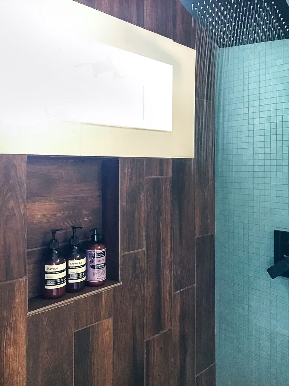 Shower featuring a rainfall shower head