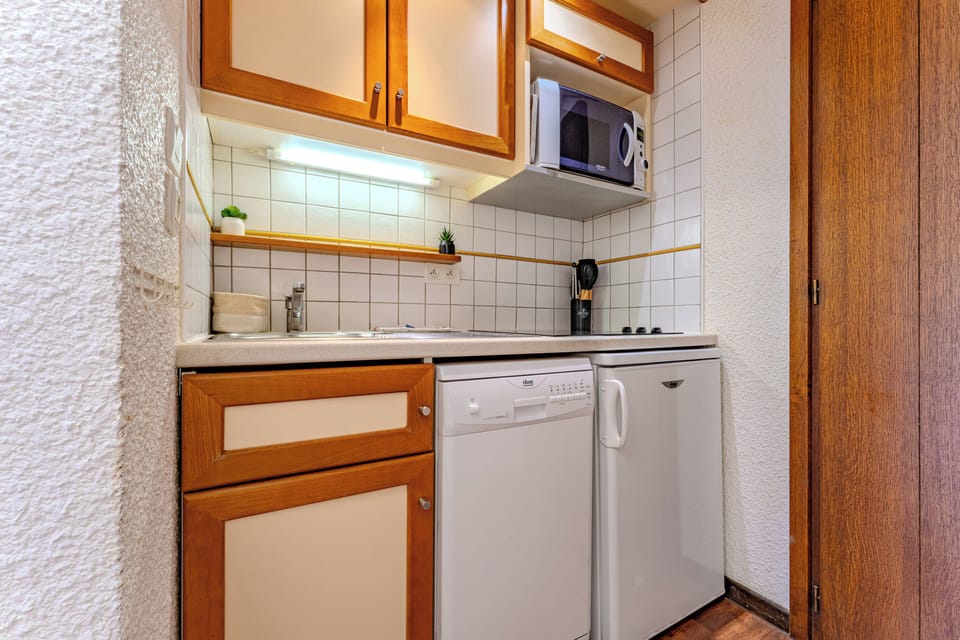 Espresso maker, coffee/tea maker, mini-fridge, microwave