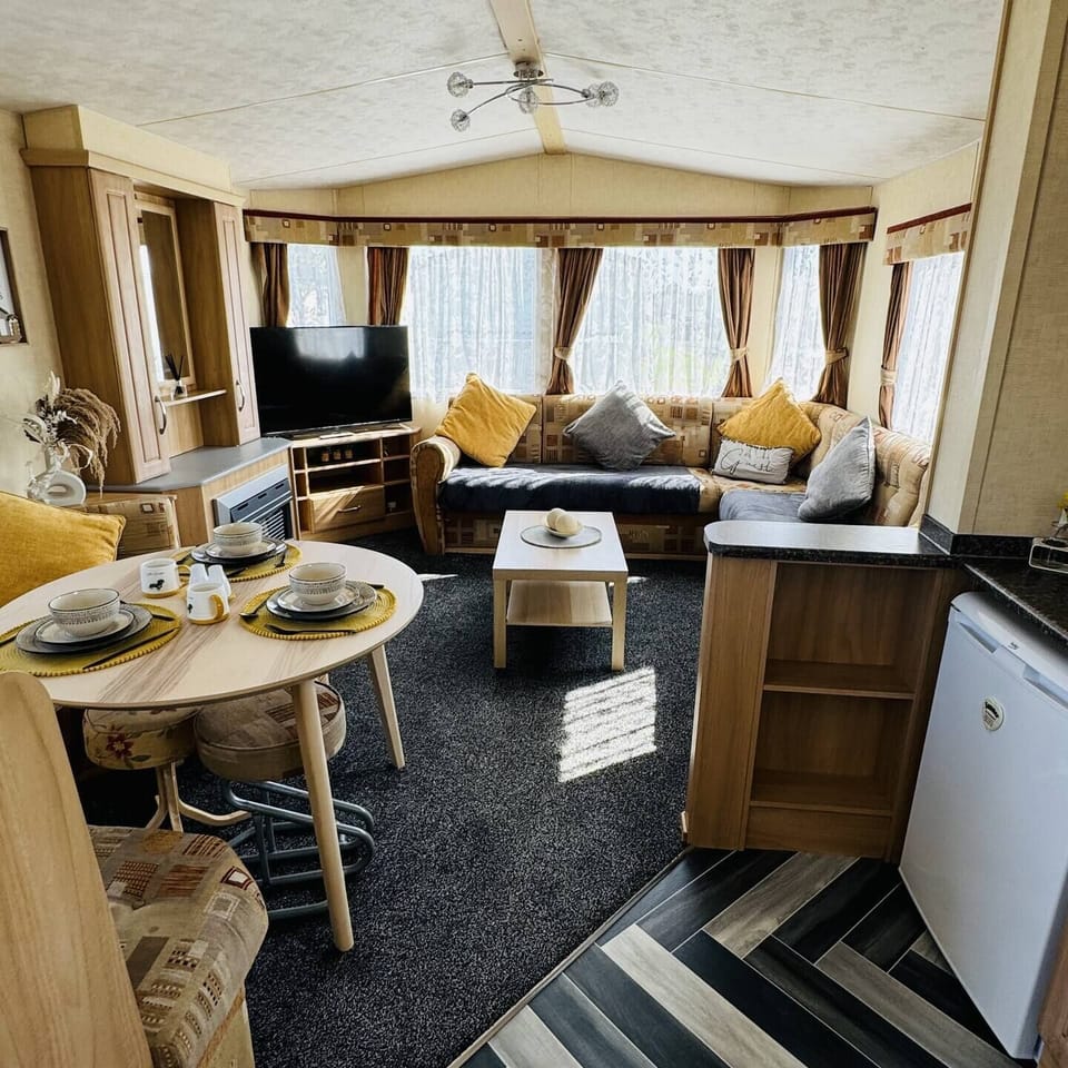 Bright and cozy space with plush seating, dining area & a smart TV—ideal for relaxing in your Skegness holiday home.