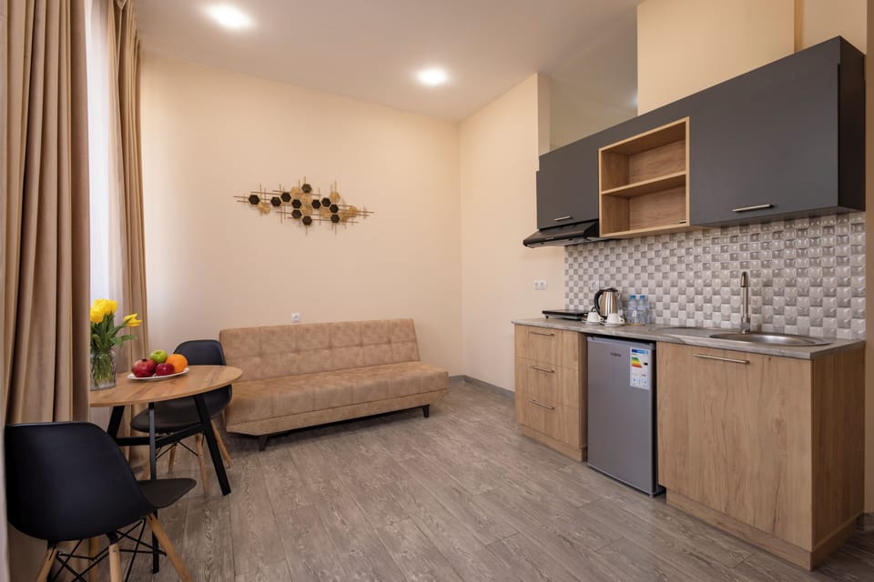 Studio, Balcony, City View | Living area | 40-inch Smart TV with digital channels