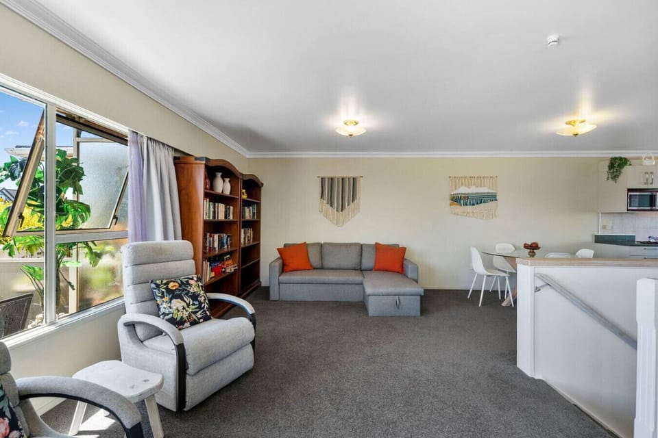 Open plan lounge, kitchen, dining area, with sofa bed