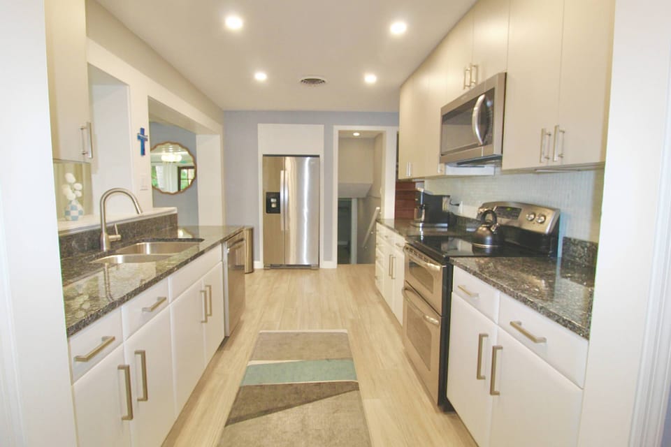 The kitchen offers stainless steel appliances & everything you need to prep and cook.