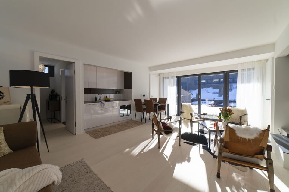 Bright living and dining area with mountain views