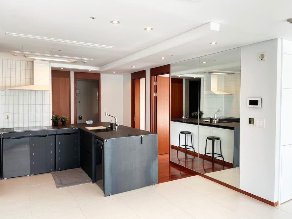 Fully equipped kitchen. Living room with open kitchen lay out.  View of the kitchen from the living room