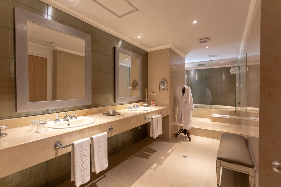 Presidential Suite, 2 Bedrooms | Bathroom | Shower, free toiletries, hair dryer, towels