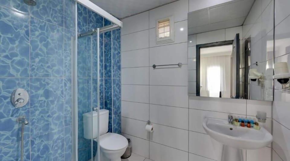 Standard Double Room, Balcony | Bathroom | Shower, hair dryer, towels, soap