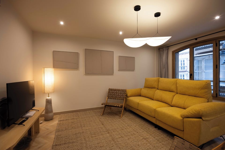 Deluxe Apartment | Living area | Flat-screen TV