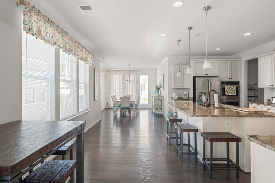 The open, airy kitchen offers ample space & all the comforts of home