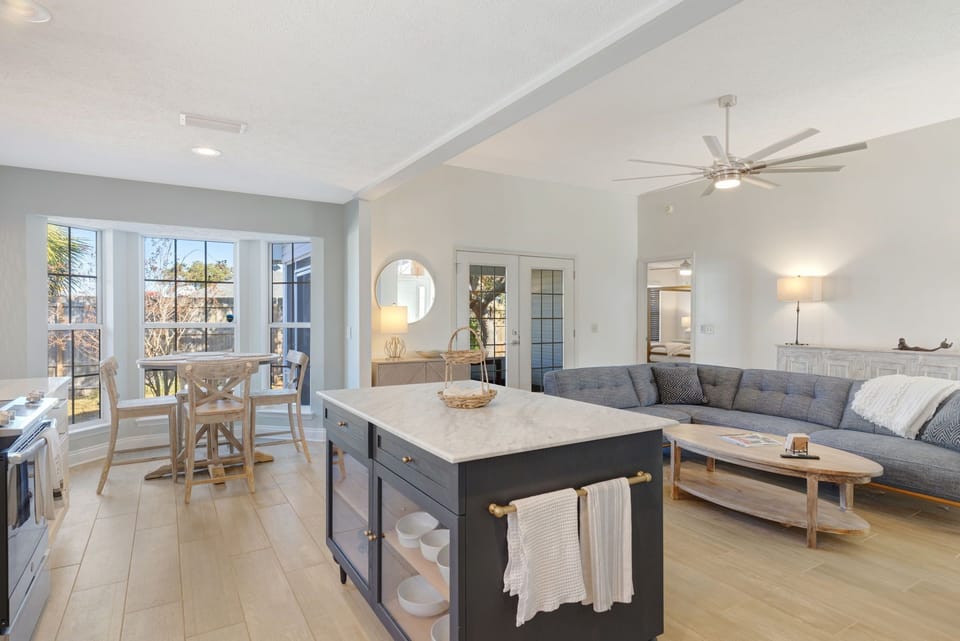 Island with barstools and storage area