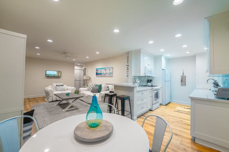 Dining offers seating for four plus bar seating for two in the kitchen.