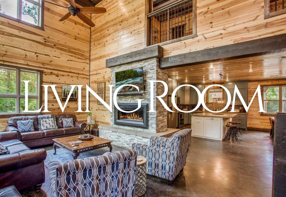 The living room, bathed in natural light from oversized windows, offers a cozy yet airy space to relax and recharge.