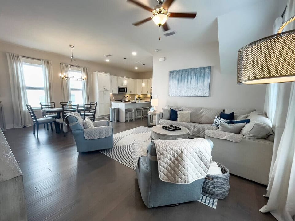 Coastal-modern living area with plenty of plush, comfortable seating.