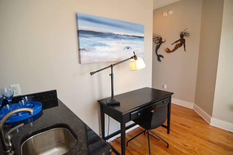 3rd Floor retreat with wet bar. Double doors lead onto a covered porch