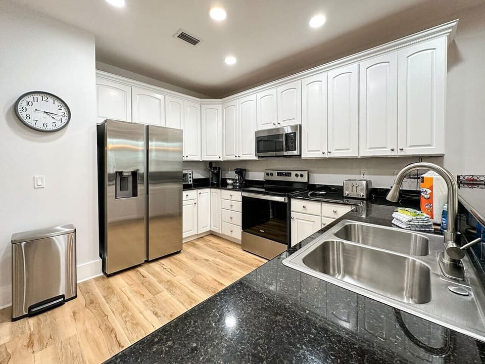 Kitchen affords plenty of counter space for meal prep