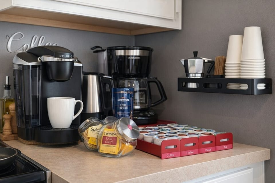 Fully stocked coffee station with coffee, tea decaf and multiple brewing options.