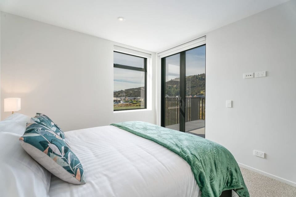 Bedroom one opens onto a balcony