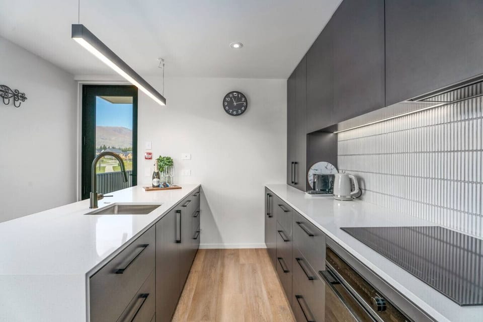 Galley style kitchen with quality appliances make cooking a breeze