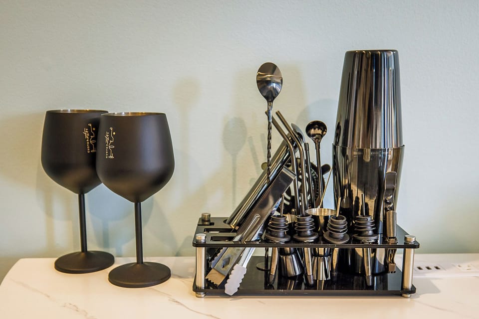 FULL ASSORTMENT OF COCKTAIL AND WINE GLASSES, UNCORK YOUR FAVORITE BOTTLE