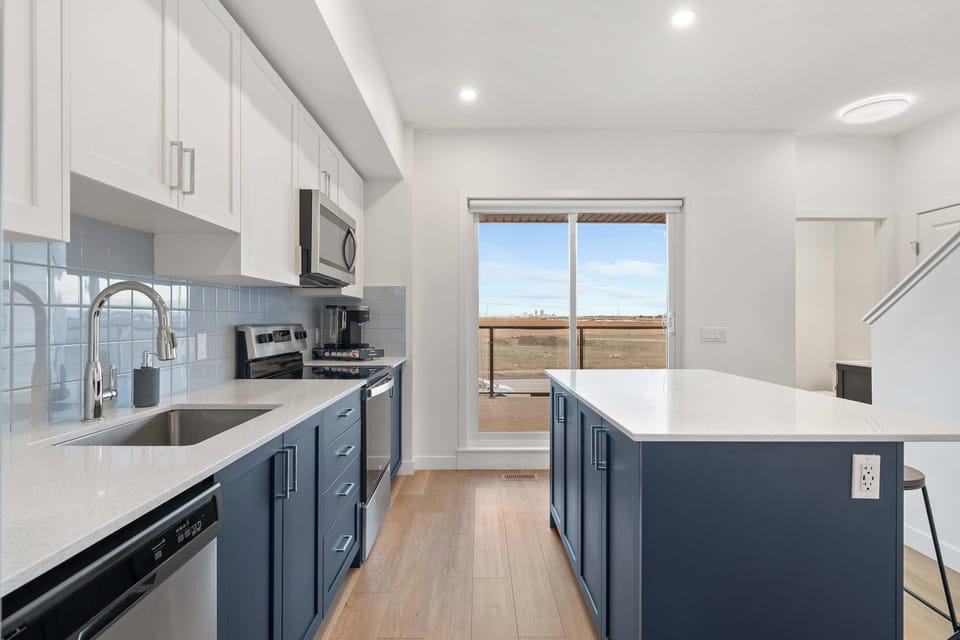 On the second floor, you’ll find a spacious open-concept layout, with the kitchen seamlessly flowing into the living room.