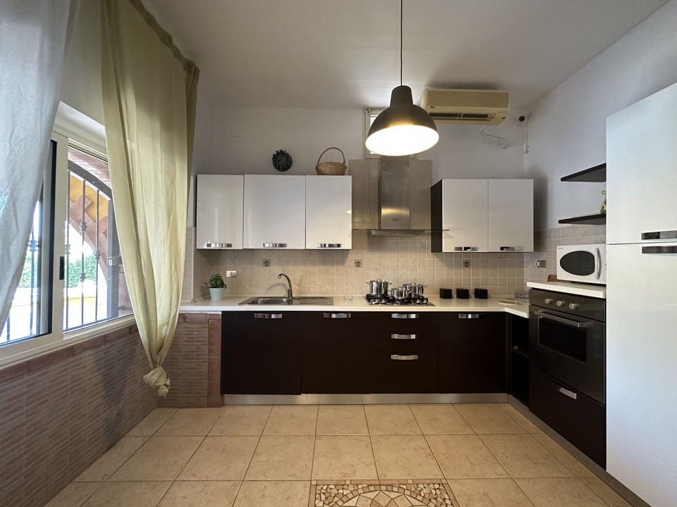 Kitchen, Kitchen Appliance, Countertop, Interior Design, Flooring, Major Appliance, Furniture, Wood, Cabinetry, Light Fixture