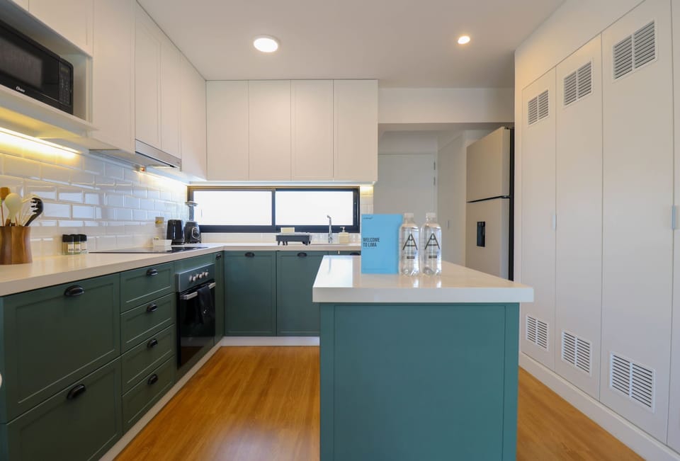 Kitchen area next to pantry/storage.