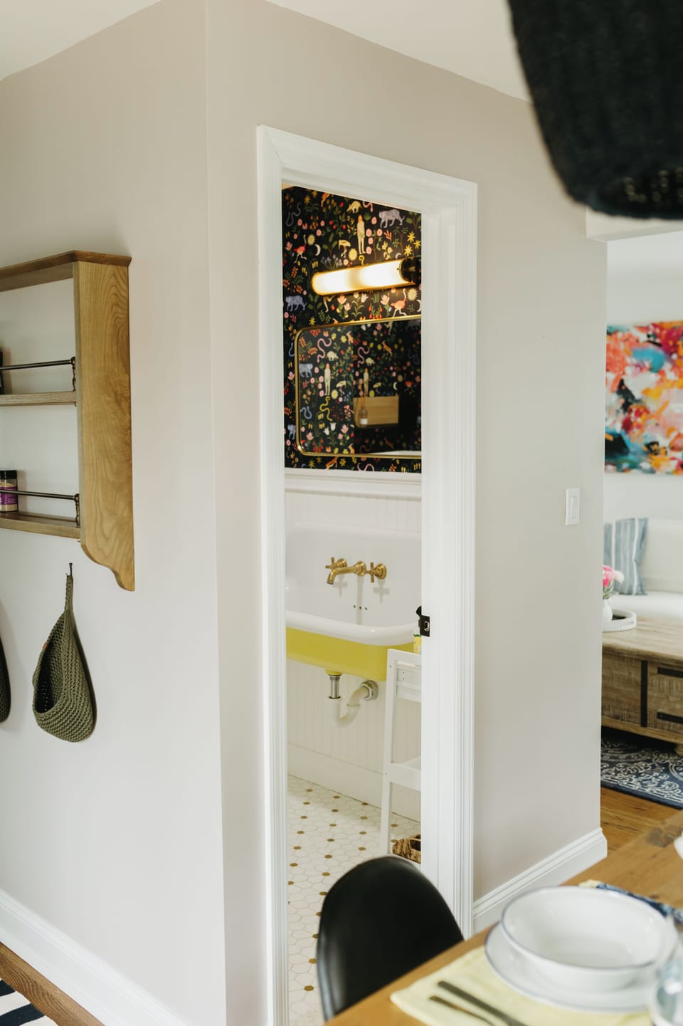 Powder room nestled between the living & dining areas