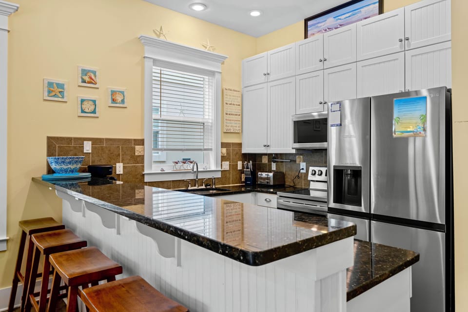 Fully stocked kitchen with stainless steel appliances