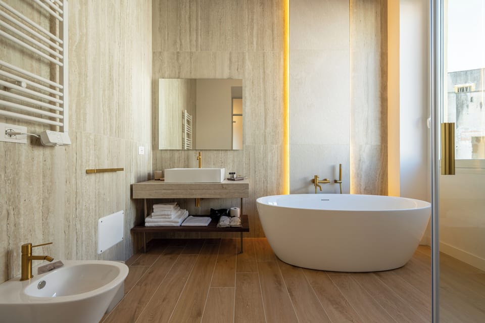 Deluxe Double or Twin Room, City View | Bathroom | Hair dryer, slippers, bidet, towels