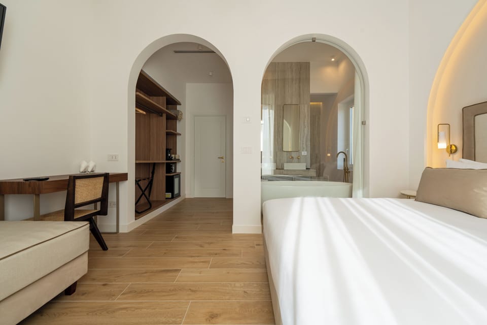 Junior Studio Suite, City View | In-room safe, desk, laptop workspace, blackout drapes