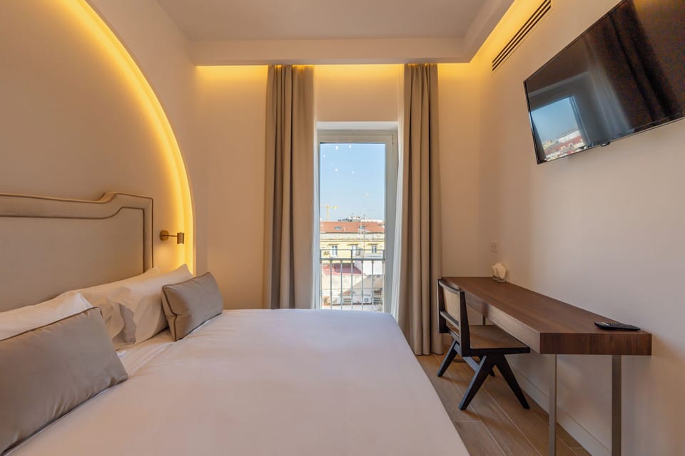 Deluxe Double or Twin Room, City View | In-room safe, desk, laptop workspace, blackout drapes