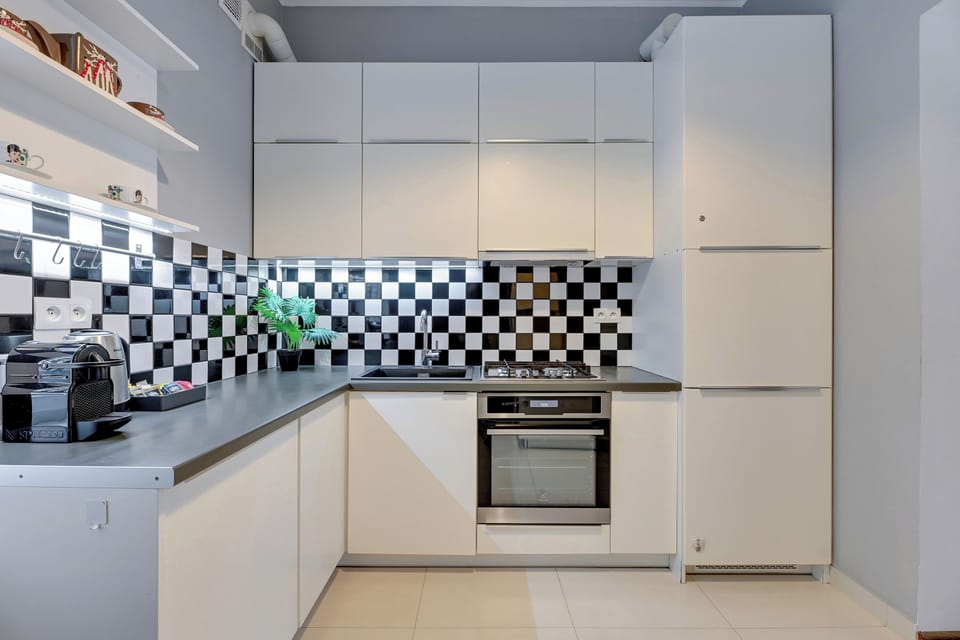 Family Apartment | Private kitchen | Coffee/tea maker, electric kettle, highchair, griddle