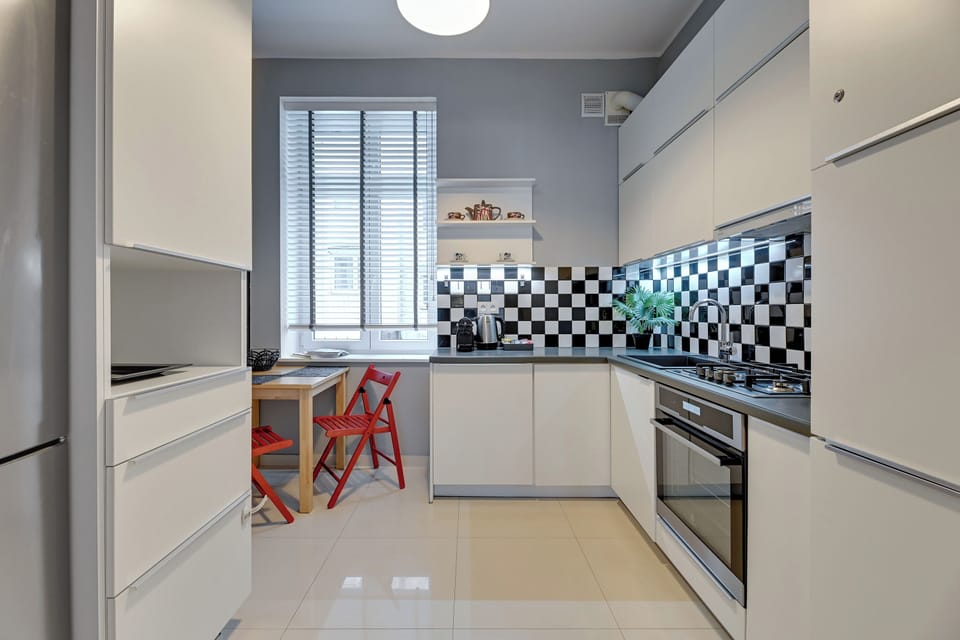 Family Apartment | Private kitchen | Coffee/tea maker, electric kettle, highchair, griddle