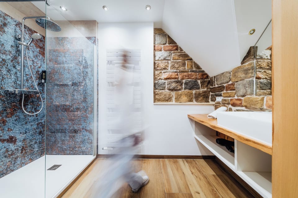 Luxury Studio Suite | Bathroom | Hair dryer, towels, soap, shampoo