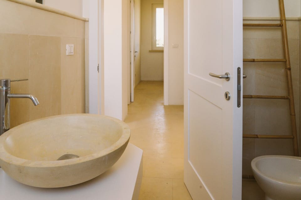 Family Apartment, 2 Bedrooms, Kitchenette, Pool View | Bathroom | Shower, hair dryer, bidet, towels