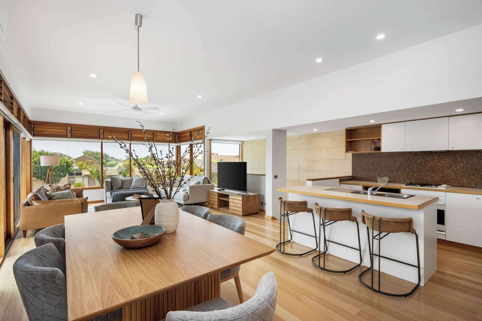 Open plan living, dining and kitchen area - beautifully designed and light-filled.