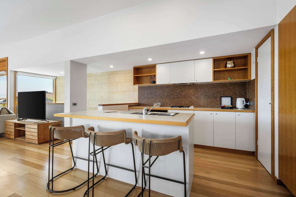 Fully-equipped kitchen with breakfast bar.