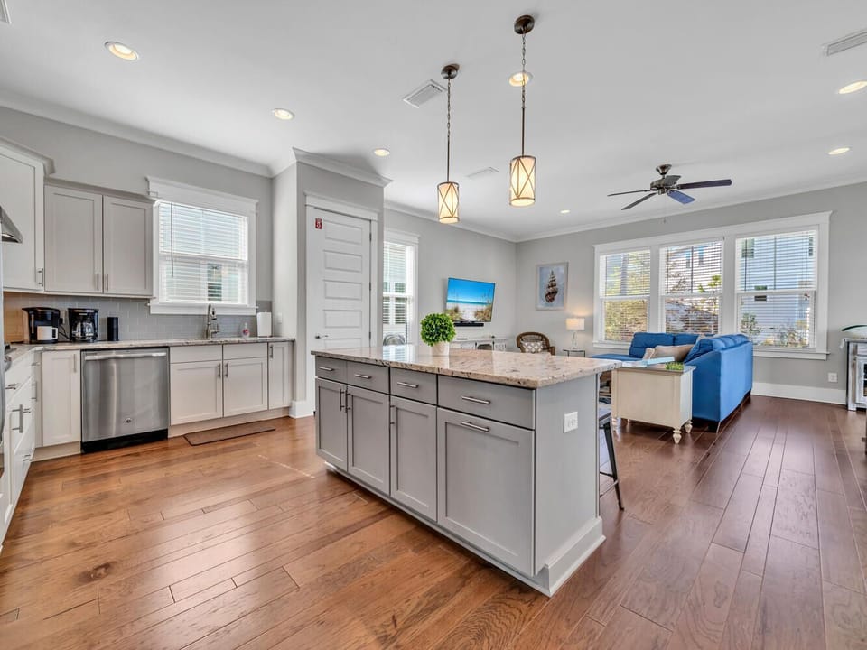 You'll love cooking and relaxing in this bright, open-concept space where the modern kitchen flows into your comfortable living area.