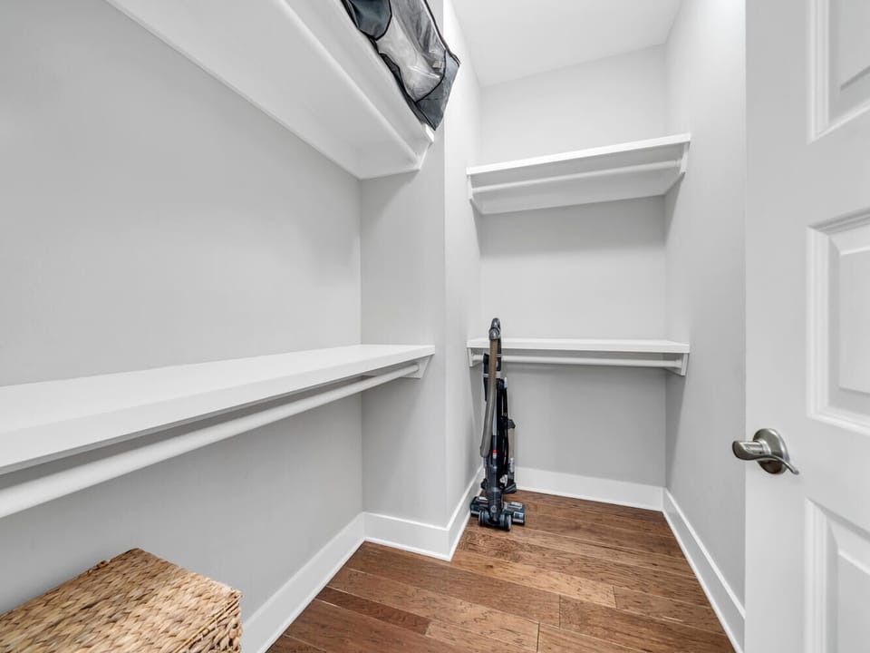 Your spacious walk-in closet features built-in shelving and hanging rods, giving you plenty of room to organize your belongings during your stay.