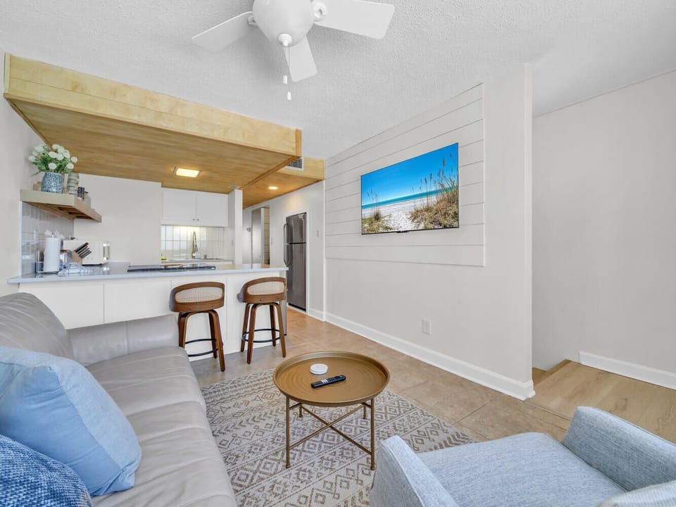 Your bright, open living space flows beautifully into a modern kitchen with coastal charm and all the comforts of home.