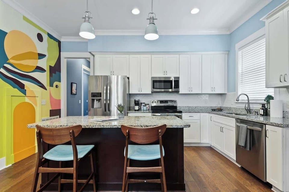 Simple and Functional - Perfect for quick bites and coffee breaks, this bar seating adds a cozy spot in a minimalist kitchen.