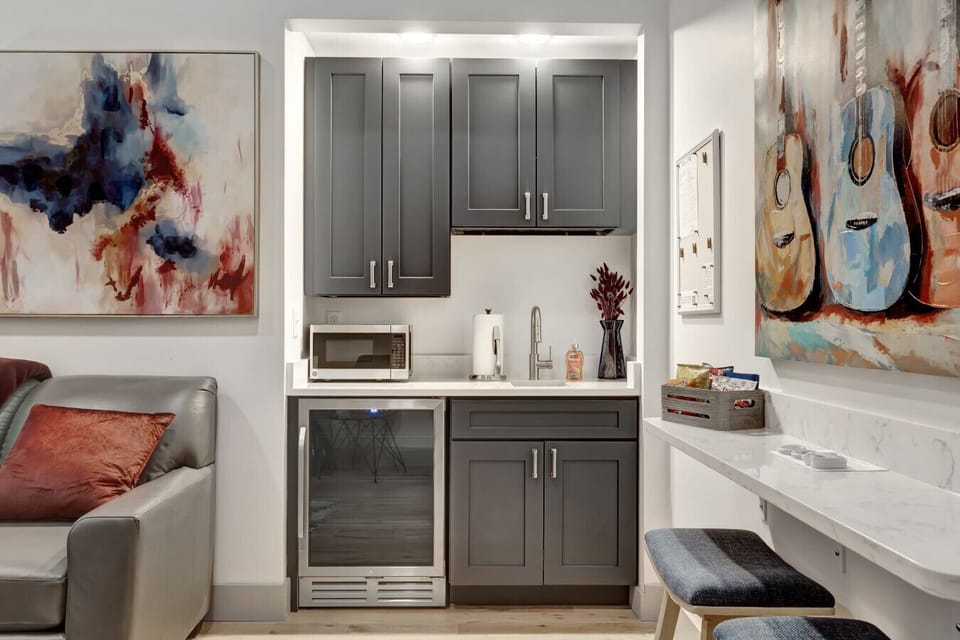 Wet Bar Features Mini-Fridge, Sink, Micro, and Coffee Maker