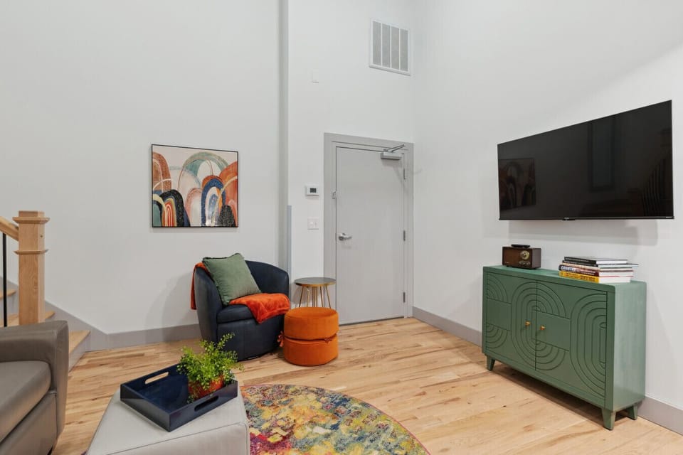 Den includes: Love seat, swivel chair, a bluetooth speaker, board games and TV.