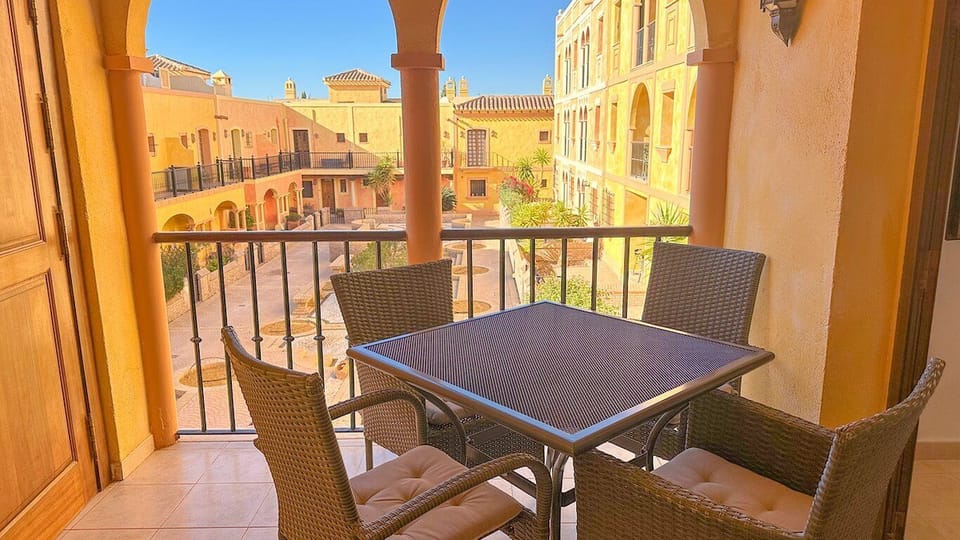 Private balcony with outdoor seating, perfect for enjoying your morning coffee.