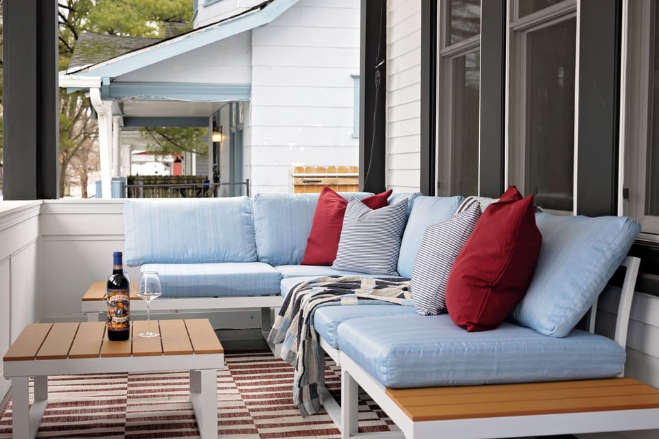 Comfort on our plush porch seat, the perfect nook for leisurely afternoons 