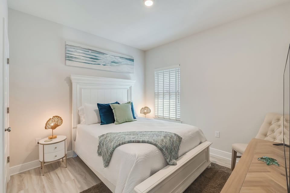 Drift into peaceful dreams in your serene bedroom sanctuary, featuring coastal-inspired decor and soft natural light.