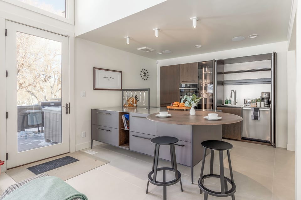 Fully Equipped Kitchen with gorgeous countertops, stainless steel appliances - including double ovens - and bar seating for two